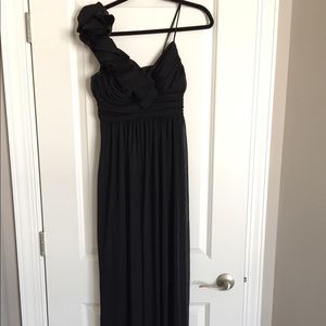 Long black one shoulder dress.